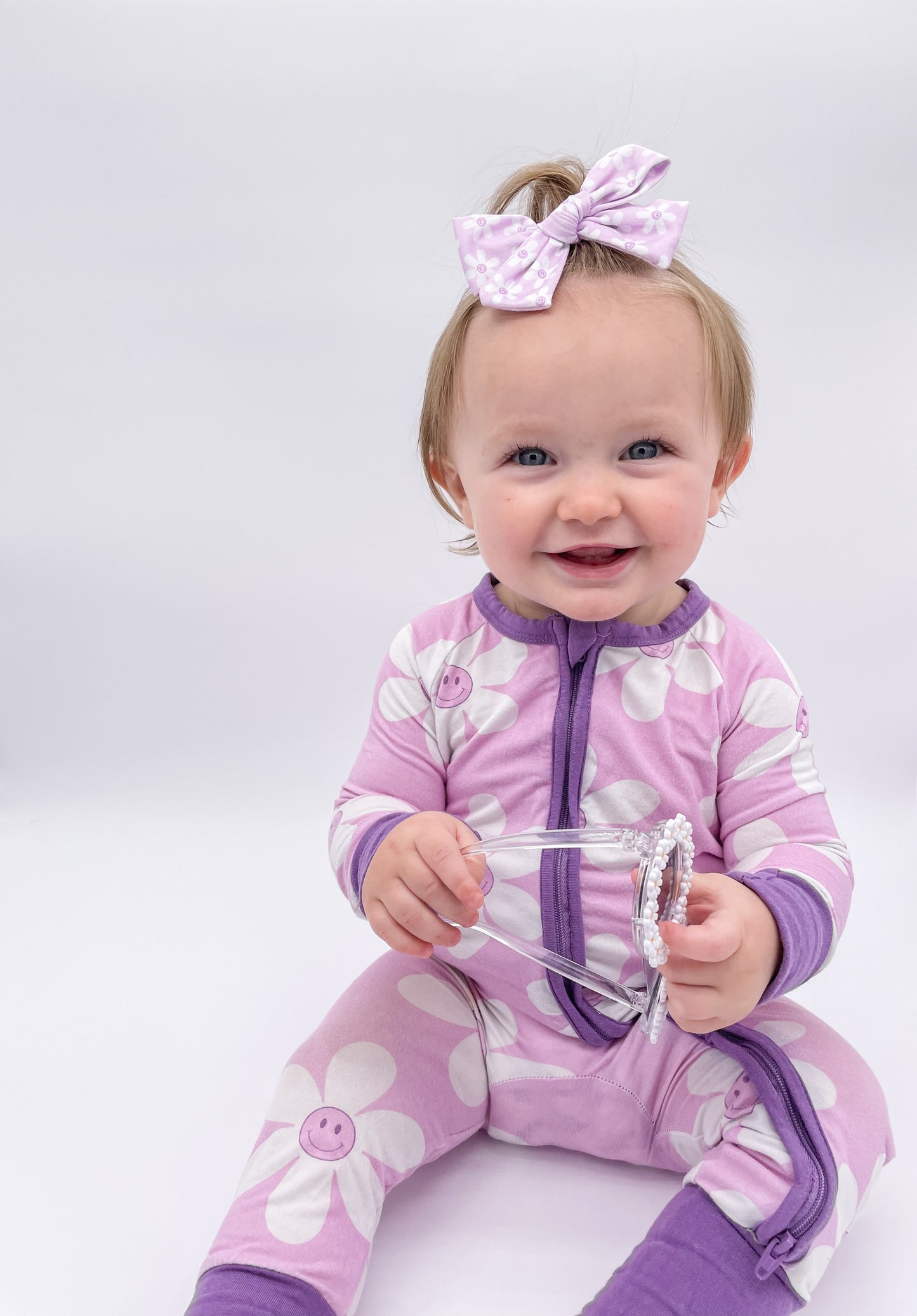 Purple Smiley Flower Bow